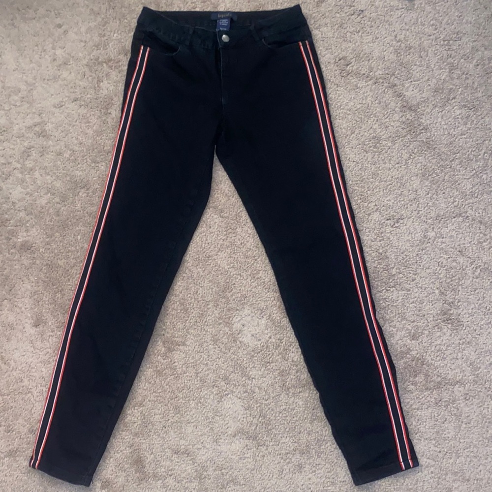 Black jeans with red stripes on the side